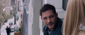 Movie still from “Venom” (2018), directed by Ruben Fleischer – A person wearing a jacket; Close Up shot, Over the shoulder angle