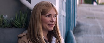 Movie still from “Venom” (2018), directed by Ruben Fleischer – A woman with long blonde straight hair looking to her left; Close Up shot, Over the shoulder angle