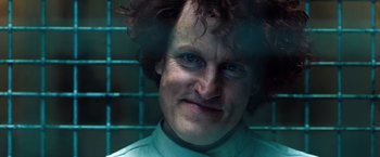 Movie still from “Venom” (2018), directed by Ruben Fleischer – A person wearing a green shirt; Close Up shot, Low angle