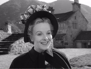 Movie still from “How Green Was My Valley” (1941), directed by John Ford – A woman wearing a hat with a bow around her head; Medium shot, Low angle
