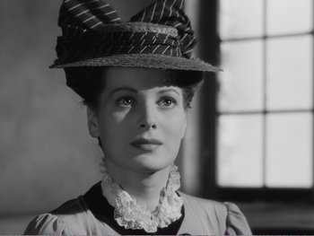 Movie still from “How Green Was My Valley” (1941), directed by John Ford – A black and white photo of a woman wearing a hat; Close Up shot, Low angle