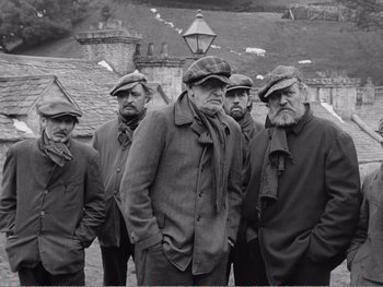 Movie still from “How Green Was My Valley” (1941), directed by John Ford – A black and white photo of a group of men; Medium shot, High angle