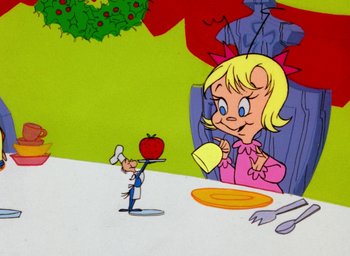 Movie still from “How the Grinch Stole Christmas!” (1966), directed by Ben Washam – A cartoon character eating an apple; Medium shot, High angle