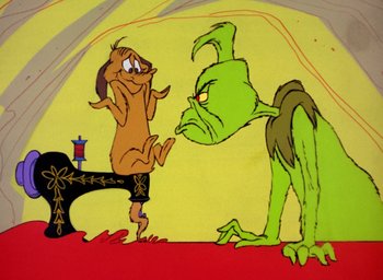 Movie still from “How the Grinch Stole Christmas!” (1966), directed by Ben Washam – A painting of a dog and the grinch; Wide shot, Low angle