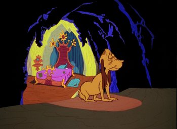 Movie still from “How the Grinch Stole Christmas!” (1966), directed by Ben Washam – A dog sitting on the floor of a cave; Wide shot, High angle