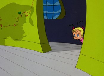 Movie still from “How the Grinch Stole Christmas!” (1966), directed by Ben Washam – A girl is looking out a window in a room; Wide shot, Low angle