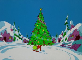 Movie still from “How the Grinch Stole Christmas!” (1966), directed by Ben Washam – The grinch sitting under a christmas tree in the middle of a snowy field; Extreme Wide shot, Low angle