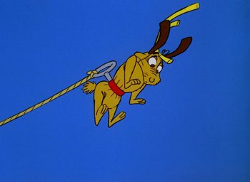 Movie still from “How the Grinch Stole Christmas!” (1966), directed by Ben Washam – A cartoon of a dog holding a stick in the air; Wide shot, Low angle