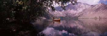 A person in a canoe on a body of water