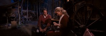 Movie still from “How the West Was Won” (1962), directed by George Marshall – A man and a woman sitting next to each other; Medium shot, Over the shoulder angle