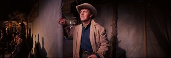 Movie still from “How the West Was Won” (1962), directed by George Marshall – A man wearing a cowboy hat and a jacket; Medium shot, Low angle