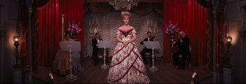 Movie still from “How the West Was Won” (1962), directed by George Marshall – A woman dressed in a dress with a long skirt; Wide shot, Low angle