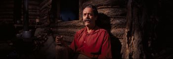 Movie still from “How the West Was Won” (1962), directed by George Marshall – An older man with a mustache wearing a red shirt; Medium shot, Low angle