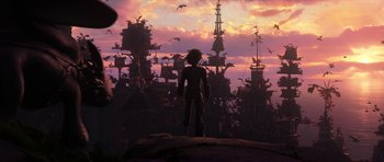 Movie still from “How to Train Your Dragon: The Hidden World” (2019), directed by Dean DeBlois – A man standing on top of a hill looking at a city; Extreme Wide shot, Low angle