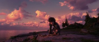 Movie still from “How to Train Your Dragon: The Hidden World” (2019), directed by Dean DeBlois – A person kneeling on the ground in front of a sky background; Wide shot, Low angle