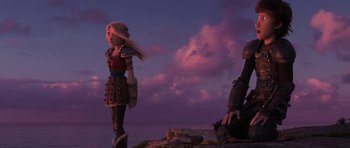 Movie still from “How to Train Your Dragon: The Hidden World” (2019), directed by Dean DeBlois – A woman standing next to a man on top of a rock; Wide shot, Over the shoulder angle