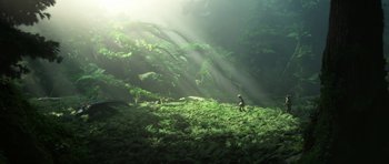 Movie still from “How to Train Your Dragon: The Hidden World” (2019), directed by Dean DeBlois – A person walking through a lush green forest; Extreme Wide shot, High angle