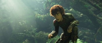 Movie still from “How to Train Your Dragon: The Hidden World” (2019), directed by Dean DeBlois – A young boy is running through the jungle; Medium shot, Low angle