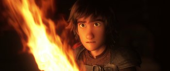 Movie still from “How to Train Your Dragon: The Hidden World” (2019), directed by Dean DeBlois – A person with a fire in the background; Close Up shot, High angle