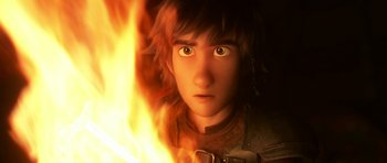 Movie still from “How to Train Your Dragon: The Hidden World” (2019), directed by Dean DeBlois – A boy's face with a fire in the background; Close Up shot, Low angle