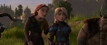 Movie still from “How to Train Your Dragon: The Hidden World” (2019), directed by Dean DeBlois – A couple of women standing next to each other in the grass; Medium shot, Over the shoulder angle