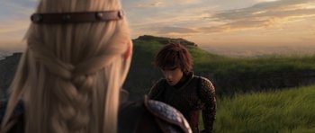 Movie still from “How to Train Your Dragon: The Hidden World” (2019), directed by Dean DeBlois – A woman standing next to a man in a field; Medium shot, Over the shoulder angle