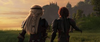 Movie still from “How to Train Your Dragon: The Hidden World” (2019), directed by Dean DeBlois – A couple of people that are standing in the grass; Wide shot, Over the shoulder angle