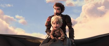 Movie still from “How to Train Your Dragon: The Hidden World” (2019), directed by Dean DeBlois – A man and a boy riding on the back of a horse; Medium shot, Low angle