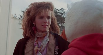 Movie still from “Howard the Duck” (1986), directed by Willard Huyck – A young woman talking to another woman outside; Close Up shot, Over the shoulder angle