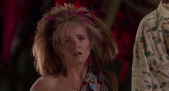 Movie still from “Howard the Duck” (1986), directed by Willard Huyck – A person wearing a wig; Close Up shot, Low angle