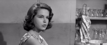 Movie still from “Hud” (1963), directed by Martin Ritt – A black - and - white photo of a young woman; Close Up shot, Low angle