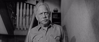Movie still from “Hud” (1963), directed by Martin Ritt – An older man in a shirt and tie; Close Up shot, Low angle