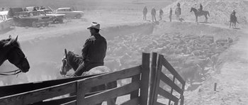 Movie still from “Hud” (1963), directed by Martin Ritt – A black and white photo of a man on a horse; Wide shot, High angle