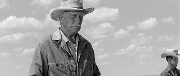 Movie still from “Hud” (1963), directed by Martin Ritt – An older man wearing a hat and a jacket; Close Up shot, Low angle