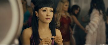 Movie still from “Hustlers” (2019), directed by Lorene Scafaria – A woman with long black hair holding a cell phone; Close Up shot, Over the shoulder angle