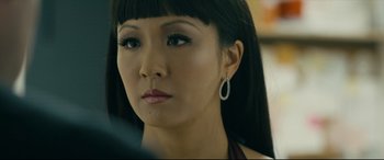 Movie still from “Hustlers” (2019), directed by Lorene Scafaria – A person wearing a necklace; Close Up shot, Over the shoulder angle