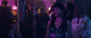 Movie still from “Hustlers” (2019), directed by Lorene Scafaria – A woman standing in front of a crowd at a party; Close Up shot, Over the shoulder angle