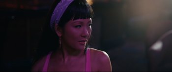 Movie still from “Hustlers” (2019), directed by Lorene Scafaria – A person wearing a headband; Close Up shot, Over the shoulder angle