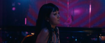 Movie still from “Hustlers” (2019), directed by Lorene Scafaria – A woman with long black hair wearing a blue dress; Close Up shot, Low angle