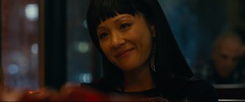 Movie still from “Hustlers” (2019), directed by Lorene Scafaria – A person with long black hair; Close Up shot, Over the shoulder angle