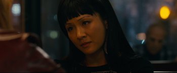 Movie still from “Hustlers” (2019), directed by Lorene Scafaria – A person with long black hair; Close Up shot, Over the shoulder angle