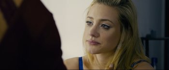 Movie still from “Hustlers” (2019), directed by Lorene Scafaria – A beautiful young lady looking at a mirror; Close Up shot, Over the shoulder angle
