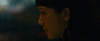 Movie still from “Hustlers” (2019), directed by Lorene Scafaria – A woman's face in the dark; Close Up shot, Low angle