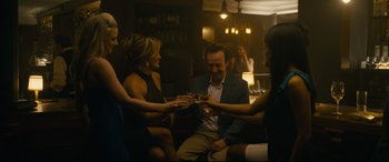Movie still from “Hustlers” (2019), directed by Lorene Scafaria – A group of people are toasting at a party; Medium shot, High angle