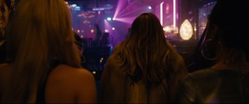 Movie still from “Hustlers” (2019), directed by Lorene Scafaria – A woman standing in front of a crowd at a party; Close Up shot, Over the shoulder angle