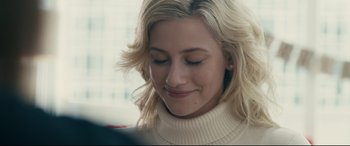 Movie still from “Hustlers” (2019), directed by Lorene Scafaria – A person wearing a sweater; Close Up shot, Over the shoulder angle