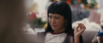 Movie still from “Hustlers” (2019), directed by Lorene Scafaria – A person sitting on a chair; Close Up shot, Over the shoulder angle