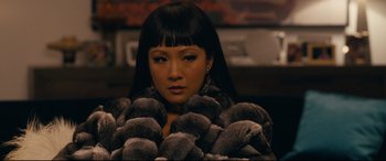 Movie still from “Hustlers” (2019), directed by Lorene Scafaria – A woman in a fur coat is looking at the camera; Close Up shot, Over the shoulder angle