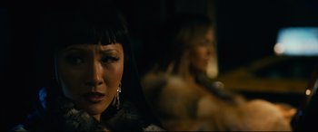 Movie still from “Hustlers” (2019), directed by Lorene Scafaria – A woman in a black jacket and a woman in a brown jacket; Close Up shot, Over the shoulder angle
