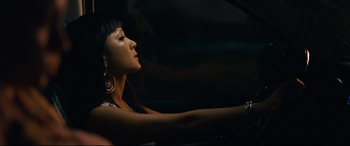 Movie still from “Hustlers” (2019), directed by Lorene Scafaria – A woman sitting in the driver's seat of a car; Close Up shot, Over the shoulder angle